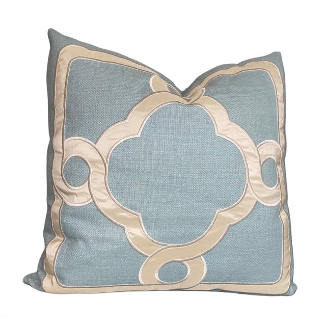 This pillow features a silk appliqué meticulously cut and secured with a satin stitch creating a bold geometric pattern...
