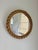 1960s Audoux Minet round wall mirror with twisted rope and a gilt brass inner ring. Mirror glass is clean, minor fraying...
