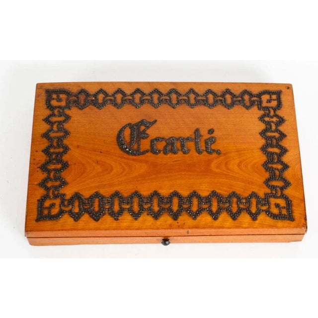 A very fine antique French satinwood "Ecarte" playing card box, circa 1870 in date. The slightly domed hinged cover...