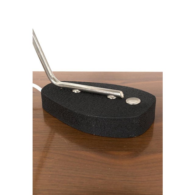 A vintage desk lamp with a round shade and an beautiful shaped base. In good vintage condition. Measurements h. 31 cm; d....