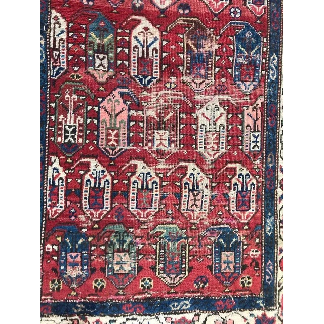 Beautiful late 19th century Kazak rug with a botteh design and natural colors with red and blue, entirely hand knotted...