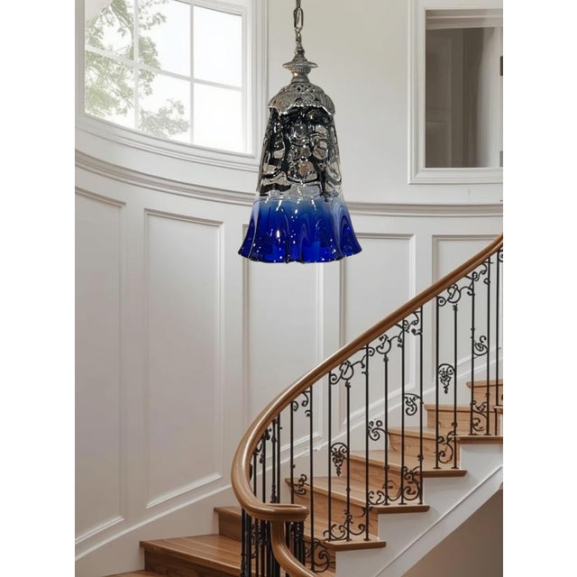 This striking one-of-a-kind pendant light showcases the artistry of hand-blown glass using the fazzoletto technique, where...