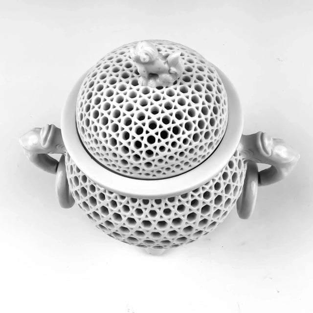 Very cool pure white Chinese porcelain tripod censer and cover. Intricate design with overall piercing on body and cover....