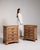 A well-matched pair of oak chests featuring multiple drawers and brass hardware that adds contrast and refinement. The...