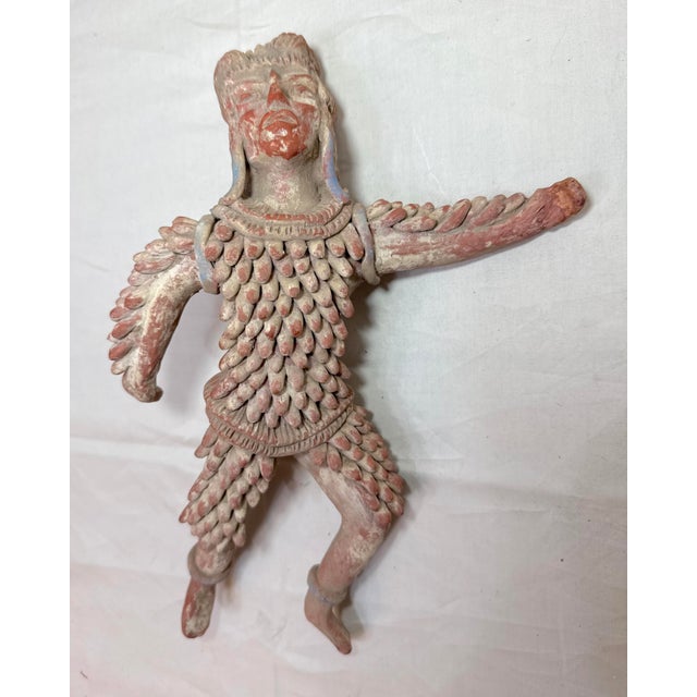 This antique 19th century handmade Mexican terracotta warrior sculpture wearing padded armor is a unique and culturally...