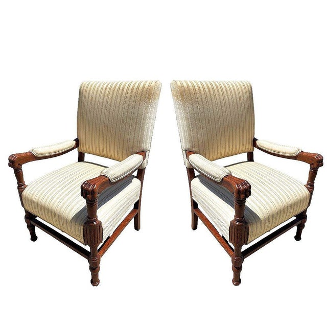 Pair of Mediterranean armchairs, crafted from rich walnut and defined by their bold lion paw armrests. The sculptural arms...