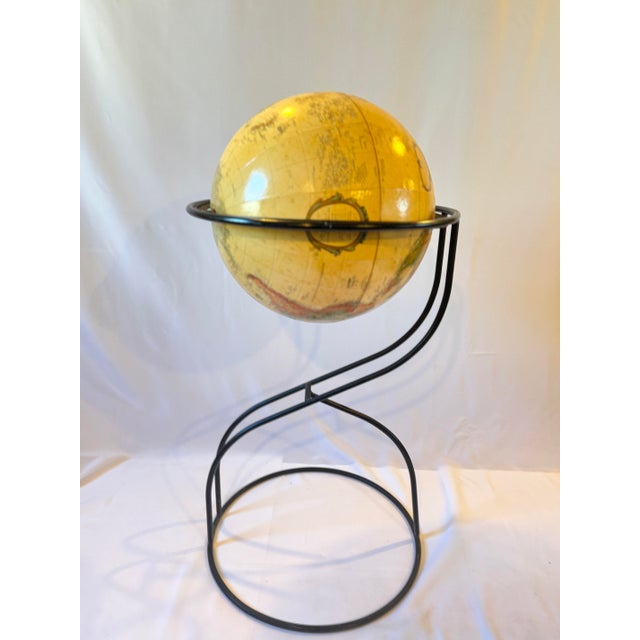 Late 20th century modern floor globe in the style of Paul McCobb. The globe is 16" in diameter and was created by...