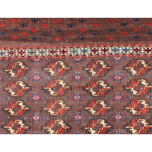 19th century antique Tekke rug with brown field and tribal motifs in red, rug g-1004, country of origin / type: Russia /...