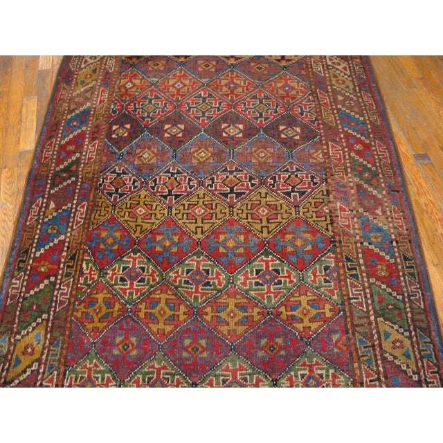 Handwoven antique NW Persian carpet. Woven, circa 1880. Gallery size: 4'3" x 9'0". All-over multi-color geometric pattern...