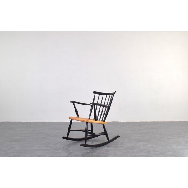 Rocking chair made in Sweden in the 60's. The armchair has been professionally and carefully restored by removing old...