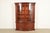 A gorgeous Georgian or Chippendale style lighted breakfront bookcase or dining cabinet By Baker Furniture, "Historic...