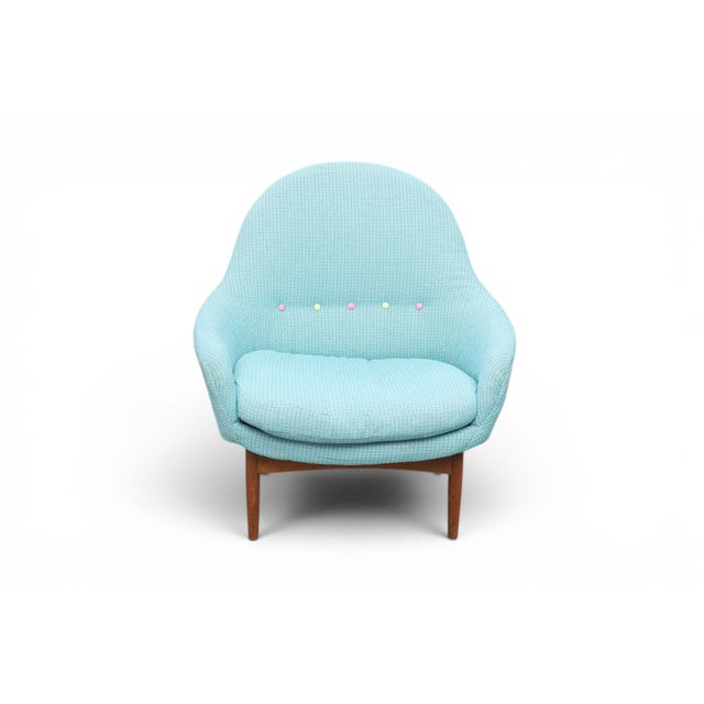 Designed by Kurt Østervig, this 1950s Danish armchair pairs a sculpted teak frame with comfortable upholstery for a piece...