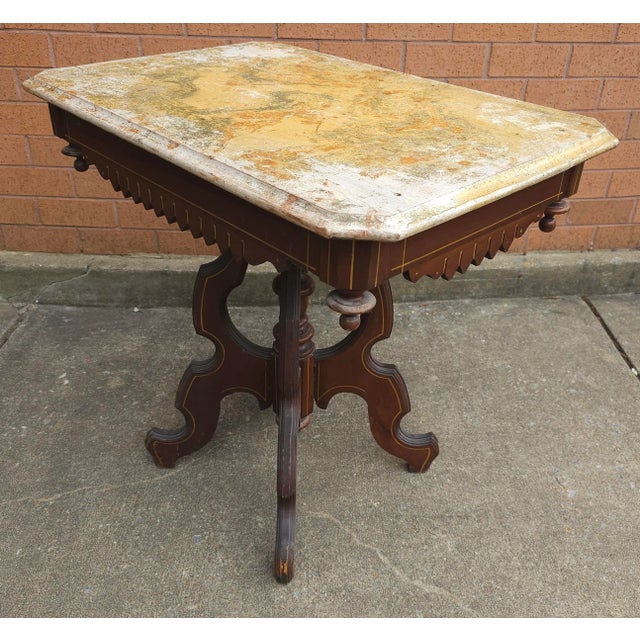 A Victorian Renaissance Style Walnut washed out Painted Side Table. Measures 29" I. Width, 19.5" in depth and stands...