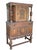 Handsome early 20th-century Jacobean Revival court cupboard crafted in richly grained oak and extensively decorated with...