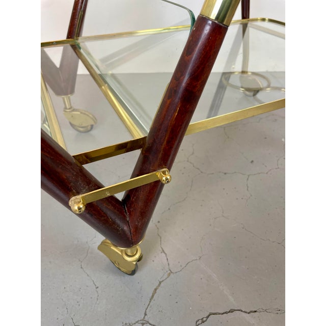 Beautiful serving trolley, bar cart with a three bottles holder, one shelve and a magazines compartment, made in wood,...