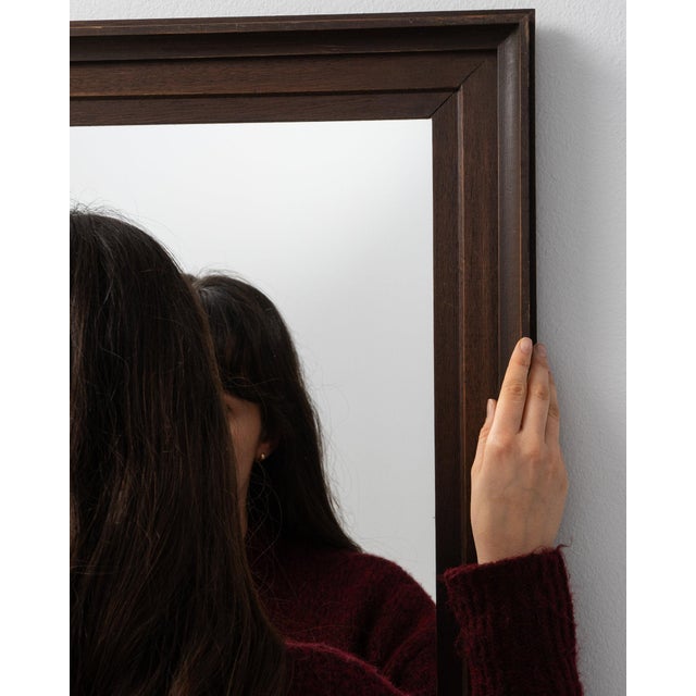 Here is a mirror, its dark walnut frame, rectangular the first thing to catch the eye. Dating to 19th Century and...
