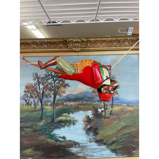 Charming vintage tin lithograph acrobat monkey toy, model MS218, made in China.This colorful mechanical toy features a...