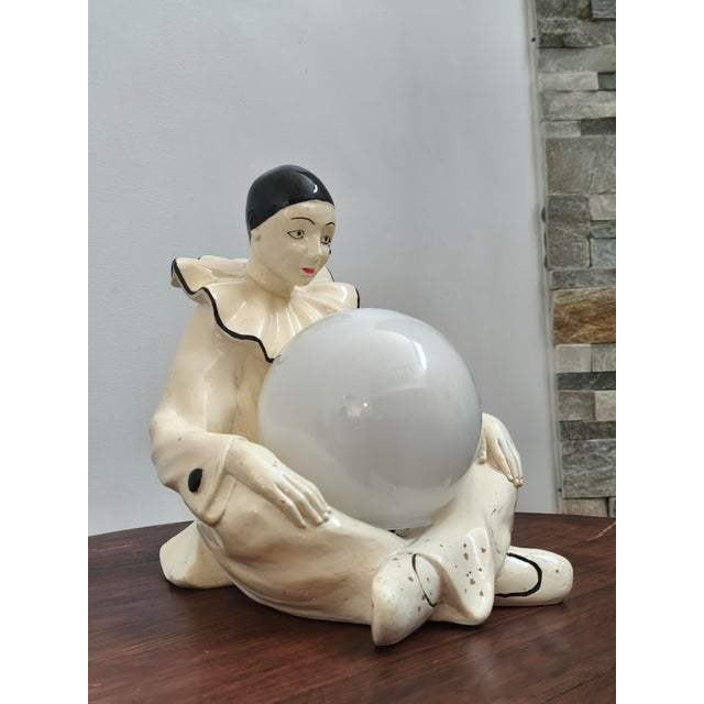 Beautiful Pierrot Commedia dell'Arte table lamp. Italy, 1970s. Features a white opaline glass diffuser globe. Height 24...