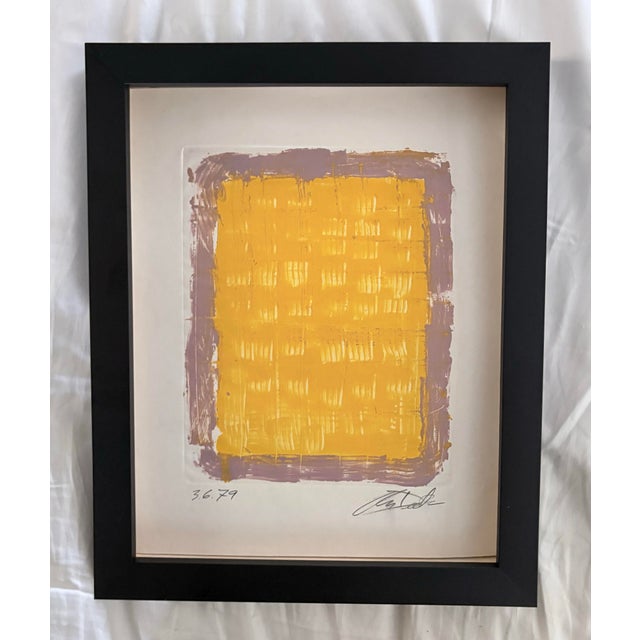 This work of art is a lithograph printed on arches paper. It is a non-representational composition that’s artist’s...