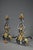 A large, beautiful pair of wrought iron mantelpieces decorated with scrolls and foliage enhanced with gold leaf. The...