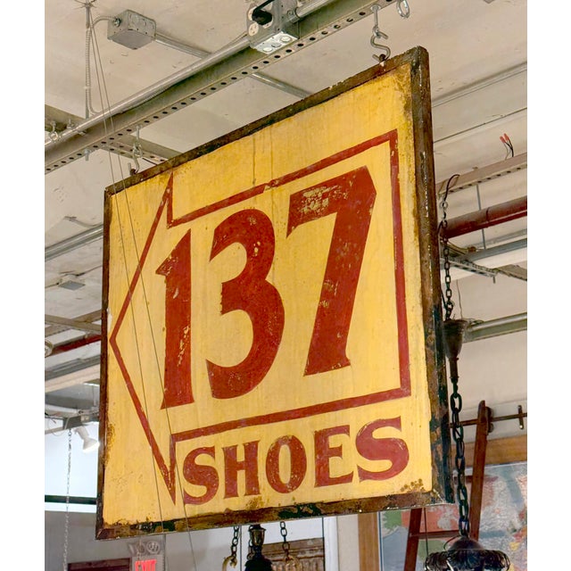 Reclaimed double sided movie set sign made of aluminum in red and yellow. The sign reads "137 SHOES". This was made to...