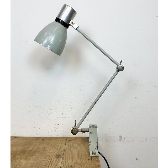 Industrial table lamp made by Elektrosvit in former Czechoslovakia during the 1970s. It features an iron base, an iron arm...