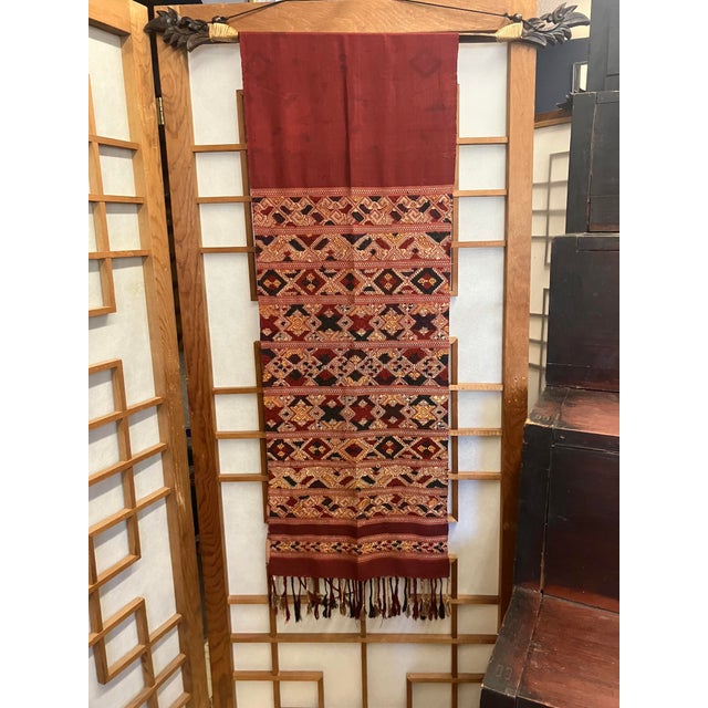 This fine example of Phaa Sabai is comprised of 100% silk & 100% cotton threads, and was handspun, -dyed, and -woven in...
