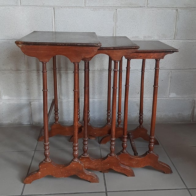 Spectacular set of three vintage nesting tables, an Edwardian English piece of furniture, composed of three interlocking...