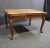 Louis XV style dining table with marquetry top, carved accents, cabriole legs and two 19.5” extensions.