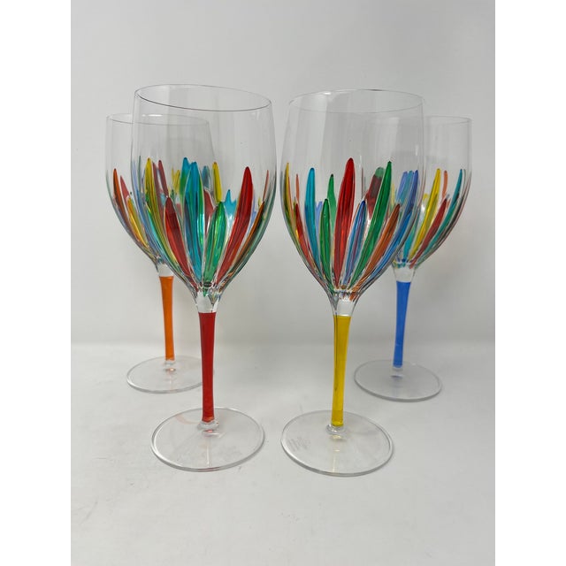 This lovely set of four wine glasses features incredible colors and it would be a wonderful addition to any room....