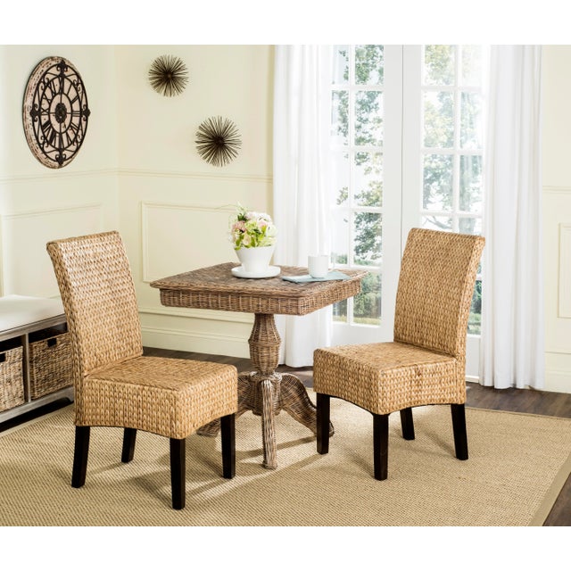 The designer look of this set of two dining chairs comes from the luxurious woven water hyacinth fiber artfully woven in a...
