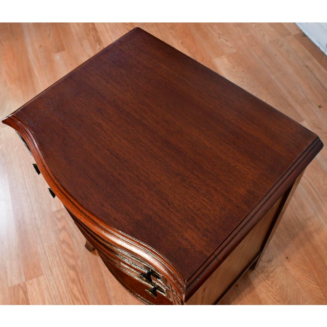 We are Pleased to offer this beautiful English Regency Nightstand, from the 1930s. This nightstand is made of Mahogany...