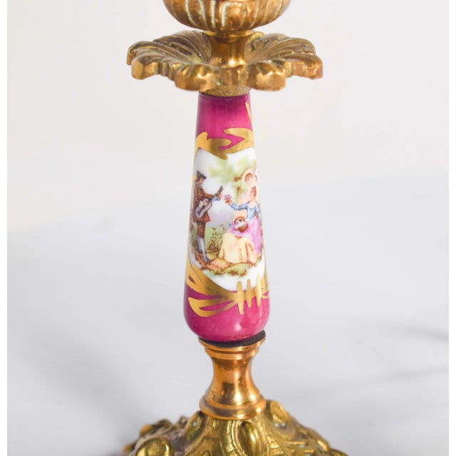 Lamp and two chandeliers in pottery and metal in the shape of candlesticks, where the base and candlestick are made of...