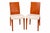 A pair of dining side chairs by Philippe Starck for Kartell. Tan molded polypropylene seat, beechwood legs and wooden...
