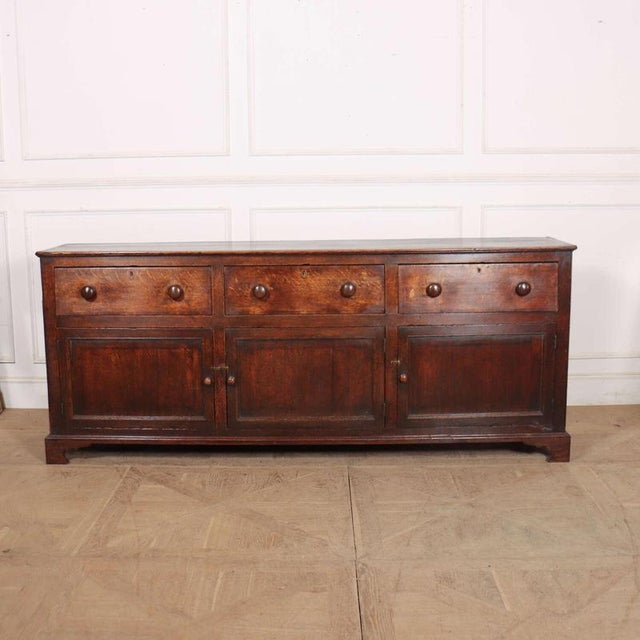 Large 18th Century English oak 3 drawer/ 3 door country house dresser base. Good colour. 1780 This piece is designed in...