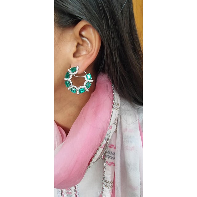 This is a beautiful Zambian natural Emerald earring with diamonds and 14k gold. the Emeralds are of very high quality and...