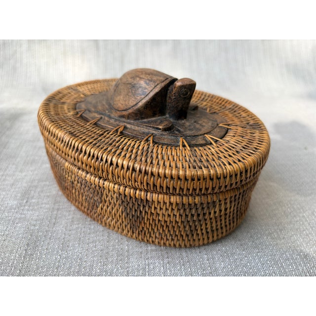 Vintage 70's, small finely woven oval Indonesian Lombok lidded basket. Basket has a wood base and a wooden carved turtle...