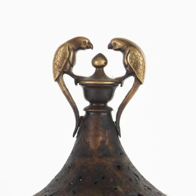 Historically rich and visually captivating, the Antique Indian Pierced Bronze Incense Burner is a decorative treasure. It...