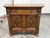Design Plus Gallery presents a 1920's Tudor Revival Carved Walnut Buffet Cabinet by Empire Manufacturing Company. This...