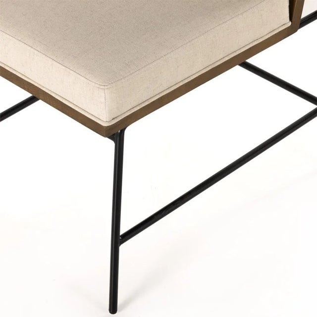 Crisp and clean, with natural panache. Slim, black-finished iron frames a floating ladderback of honey-finished oak and...