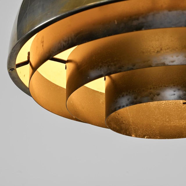 Pendant light designed by Jo Hammerborg for Fog & Mørup in Denmark in the 1960s. The light fixture features a large,...