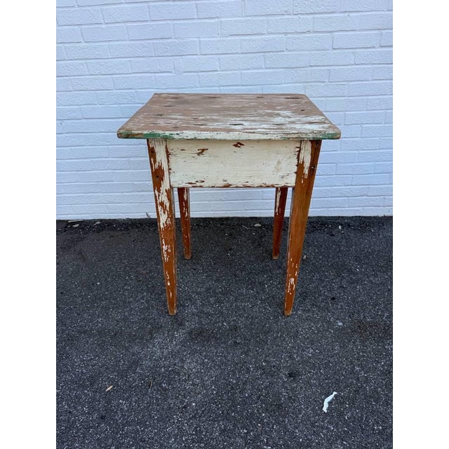 19th Century Antique Swedish Rustic Painted Pine Side Table. It features with long tapered fluted legs, many color layers....