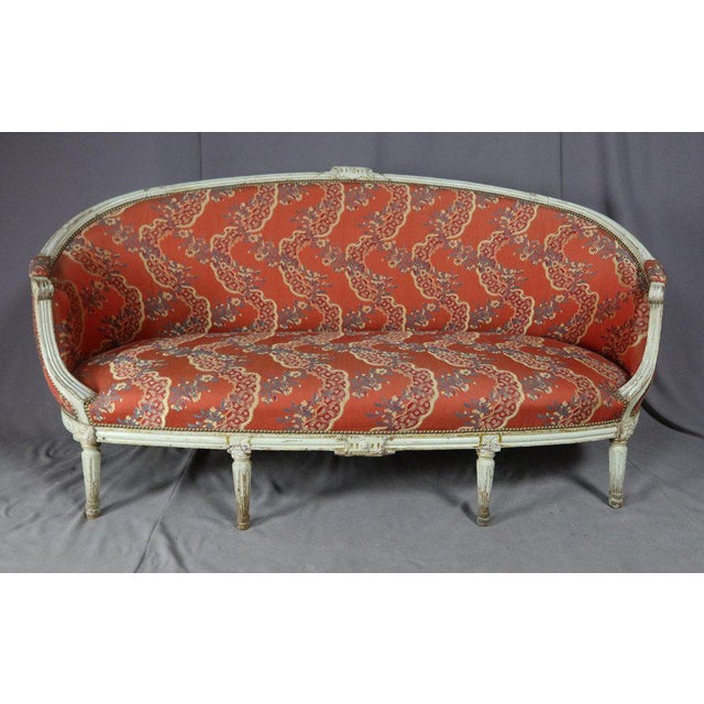 "Louis XVI period fair" Large lounge of the Louis XVI period in lacquered beech including six armchairs and a basket sofa....