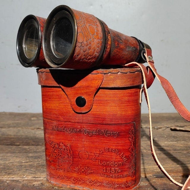 This striking pair of antique binoculars, or field glasses, is a fine example of vintage optical craftsmanship. The...