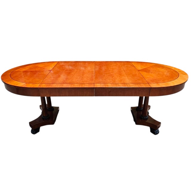 Featured is a Vintage Baker Furniture Palladian Collection Round Neoclassical Cherry Wood and Parcel Ebonized Extension...