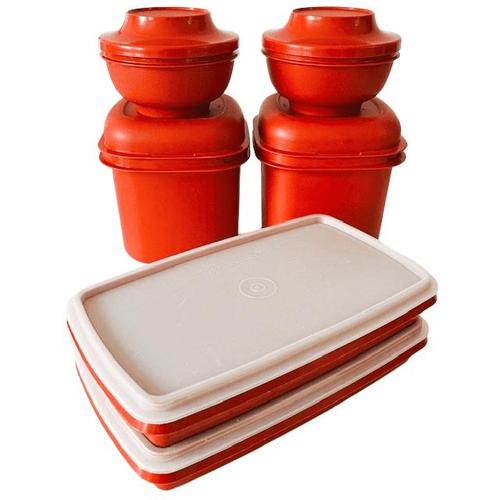 Set of three vintage Tupperware Servalier bowls with Starburst lids in harvest colors orange, red & yellow from the 1970s....
