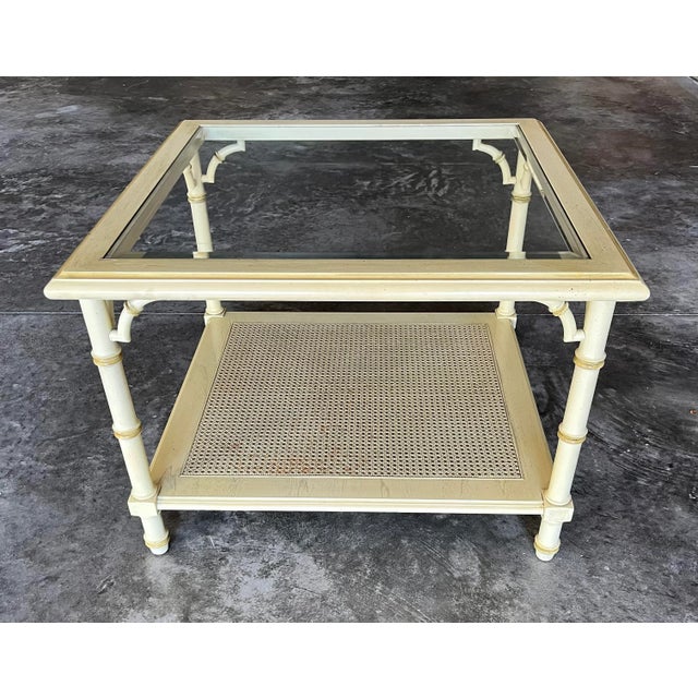 Vintage 1970s Lane Altavista faux bamboo, fretwork and cane, two-tier square coffee table. Clear beveled glass top and...