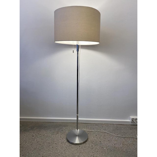 A floor lamp * by Erco * Minimalist, straight -line 70s design * Chrome frame with brushed aluminum stand * natural white...