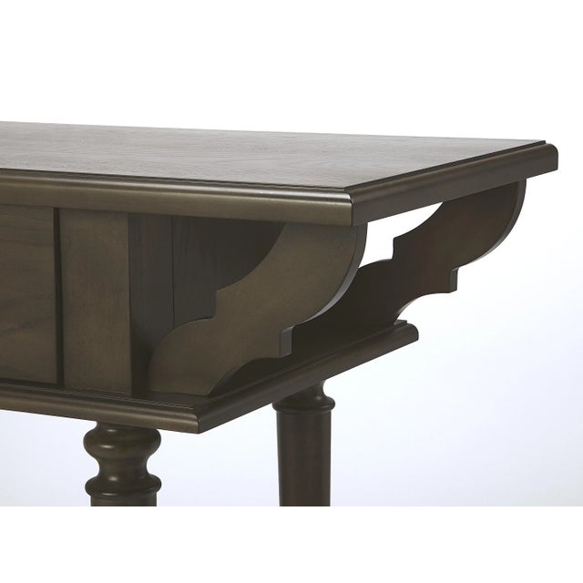 This spacious console table combines vintage styling and abundant function. Crafted from rubberWood solids, Wood products...