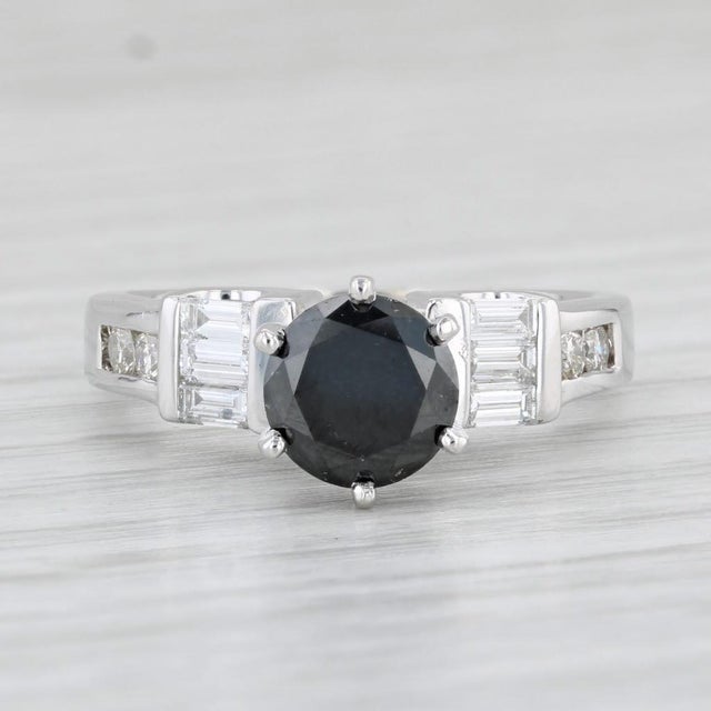 Gemstone Information: - Natural Diamond - Carats - 1.32ct Cut - Round Color - Black Treatment - Color Treated Please note...